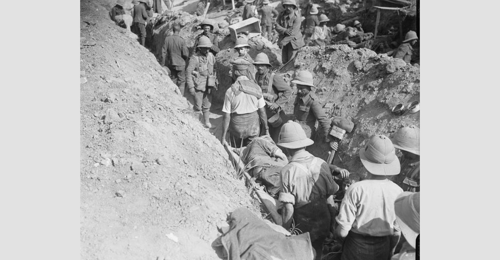 Congestion in a communication trench, with walking wounded and stretcher cases going down.