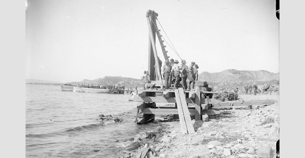 British soldiers using a pile driver for the construction of a pier and jetty.