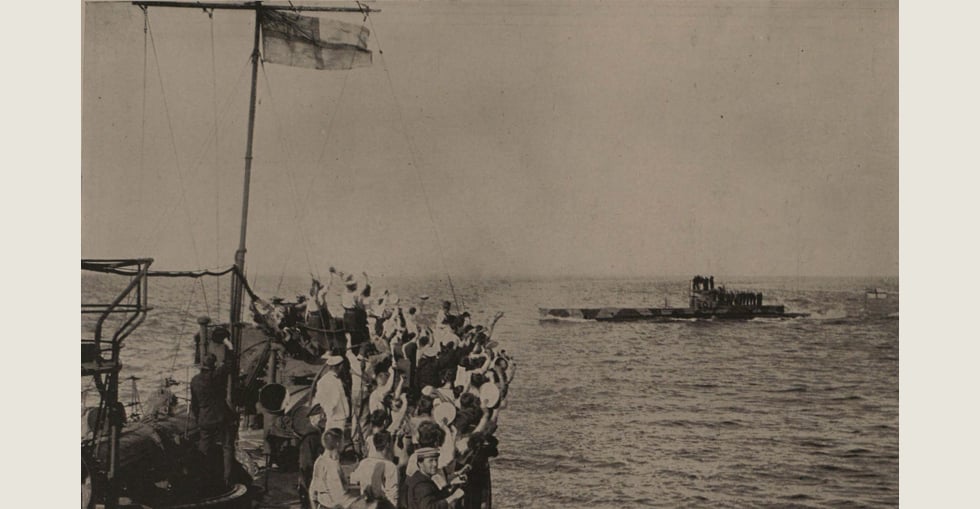 The crew of the HMS Grampus cheering the British submarine E-II which torpedoed a Turkish transport in Constantinople Harbour in May 1915