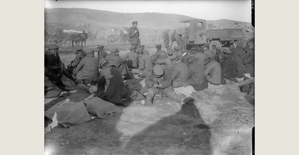 Frost-bitten British soldiers at Suvla Bay waiting to be evacuated by lorry during severe weather, November 1915.