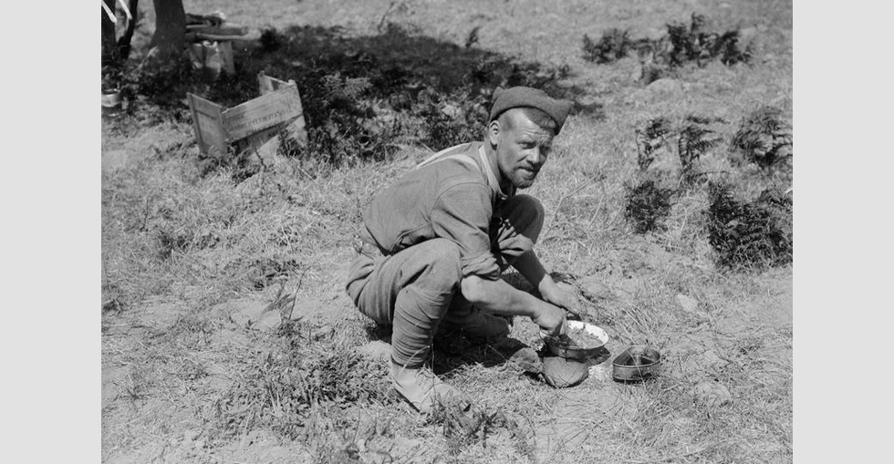 A soldier preparing a meal in a rest camp, possibly at Cape Helles.