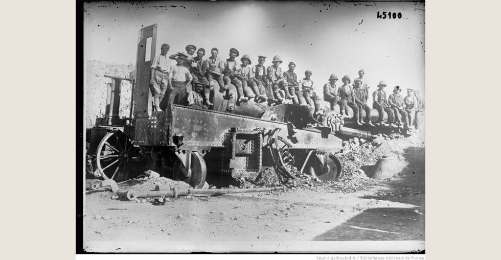 Turkish cannon at Cape Helles, large-caliber gun with British soldiers posing sitting above