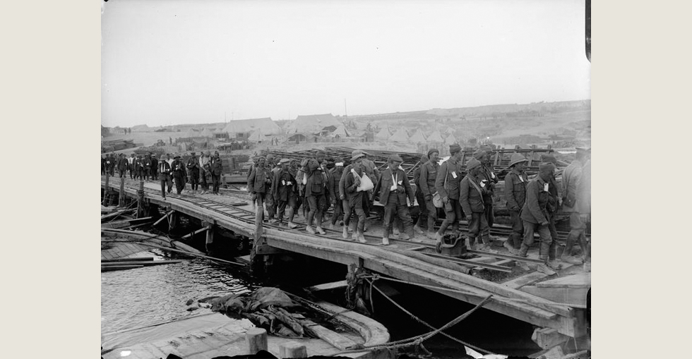 Wounded soldiers about to embark on a Hospital Ship